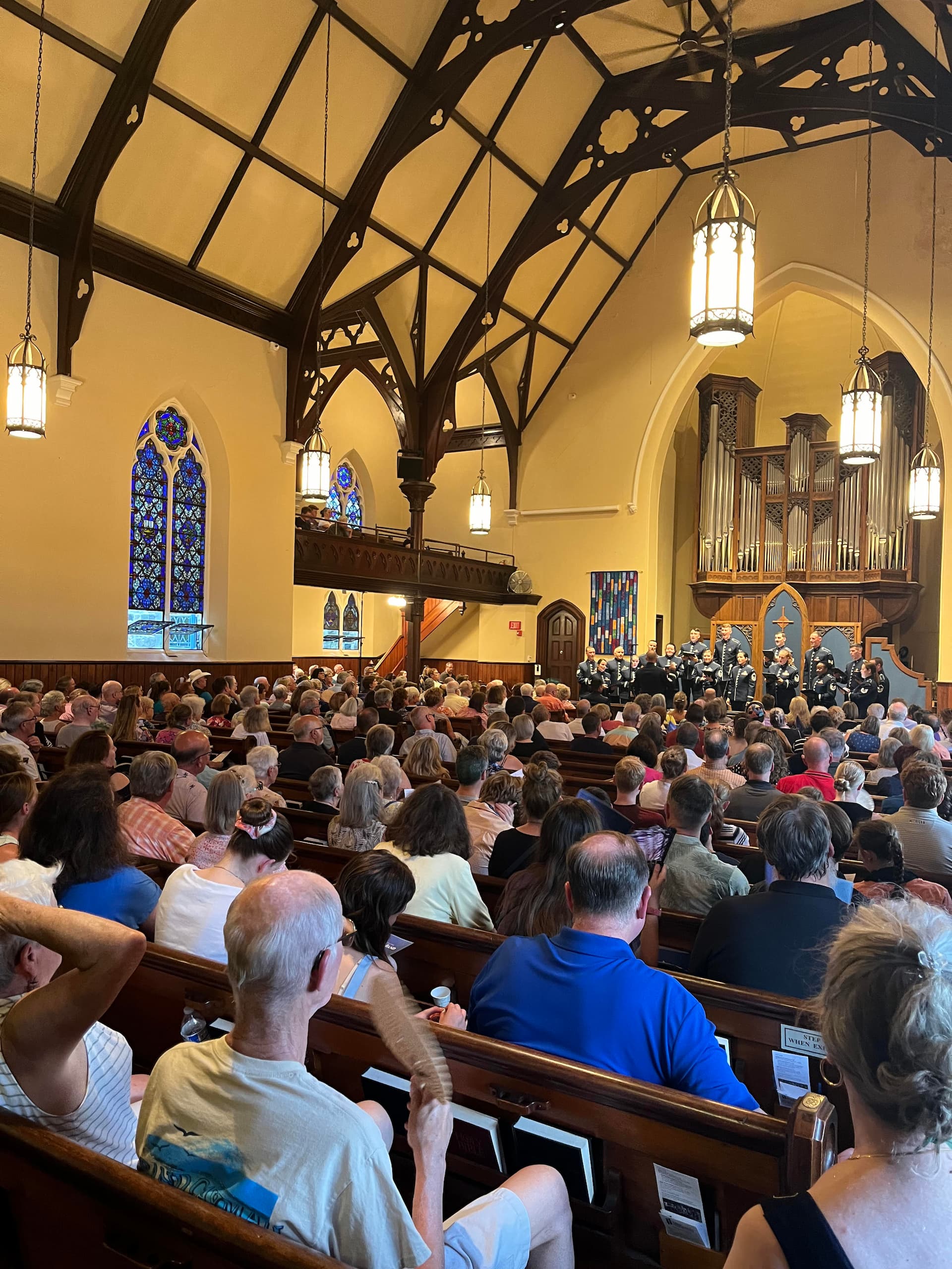 church congregation and stained glass windows