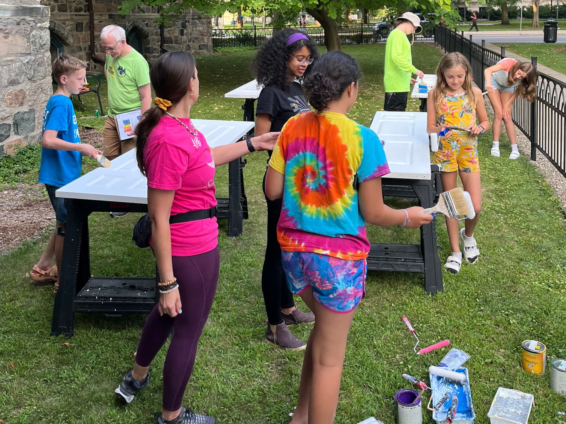 kids painting decorative inclusivity doors at FCC ann arbor